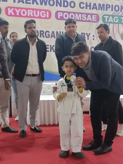 One of my youngest champions receiving his medal on stage. It's moments like these that make all the hard work worthwhile.