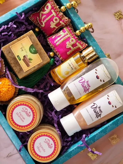 This top-down view highlights the thoughtful curation of my large Diwali hamper. It includes everything from skincare to decorative Shubh Labh hangings, making it a complete and auspicious gift.