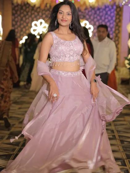 A motion shot of the client in the lavender lehenga, showing its beautiful flow.