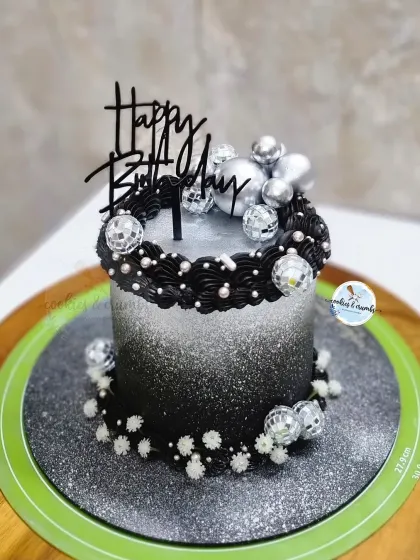 It's time to disco! This black and silver ombre cake is ready for a party, decorated with mini disco balls and sparkling edible glitter.