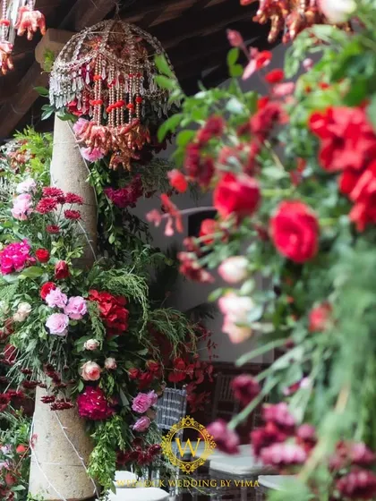 For this Varapuja ceremony, we used a vibrant palette of reds and pinks. The decor included hanging elephant charms and a mirrored backdrop to create a festive and prosperous atmosphere.