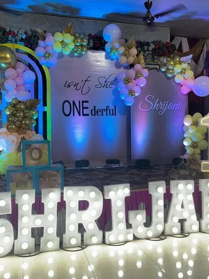 First birthdays are a big deal, and I make sure the decor is "ONEderful". This setup features large, light-up marquee letters spelling the birthday girl's name, a custom backdrop, and a pastel balloon arch, creating the perfect photo opportunity.