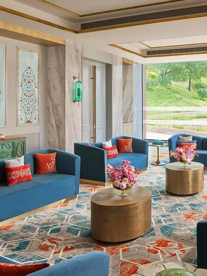 This living space at the Taj Devi Ratn Resort & Spa is a sanctuary I designed in the Pink City. The vibrant blues of the custom upholstery and the intricate patterns of the hand-knotted carpet come together to create an atmosphere of quiet luxury, where traditional Indian elements breathe within modern elegance.