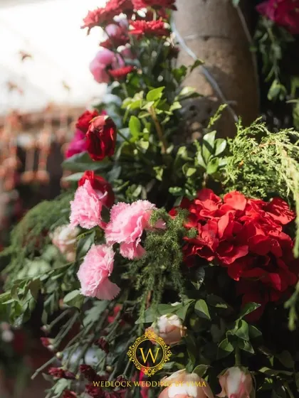 For this Varapuja ceremony, we used a vibrant palette of reds and pinks. The decor included hanging elephant charms and a mirrored backdrop to create a festive and prosperous atmosphere.