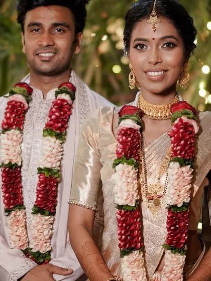 The happy couple, with the bride's pre-pleated saree looking immaculate.
