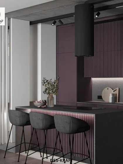 The kitchen island is the star, with its ribbed texture and ambient lighting. It’s a perfect example of how we blend bold color with sophisticated design elements.