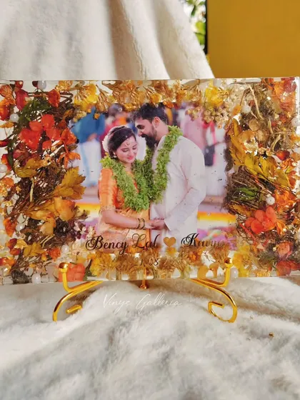 Is it possible to preserve old special flowers? Yes! I blended a client's old Tulsi varmala with bright florals to create this vibrant rectangular frame.