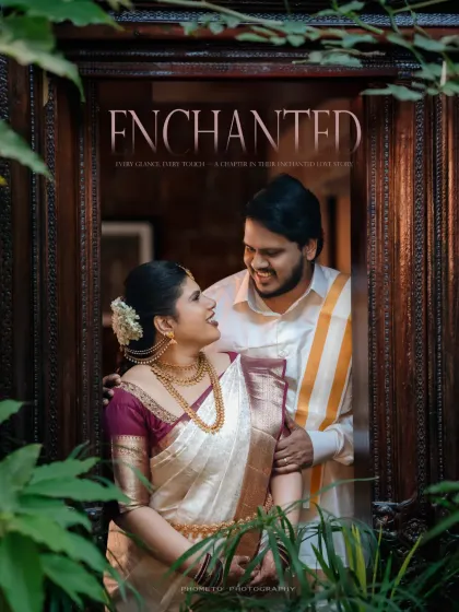 'Enchanted'. A creative shot of the couple framed through a window and foliage, creating a magical, storybook feel.