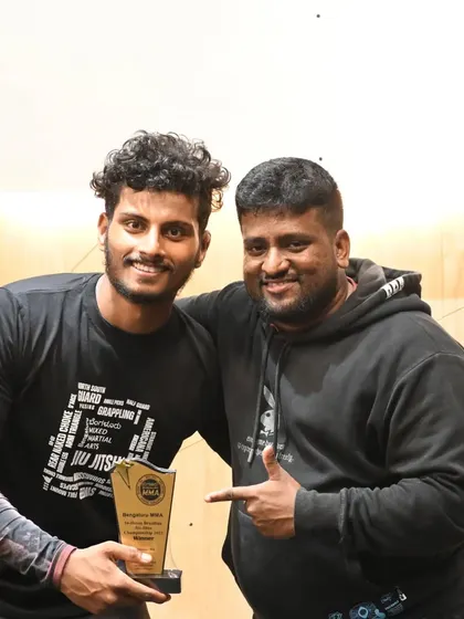 Our grappling coach Shivprasad with a student after a win at our in-house BJJ competition. The bond between coach and student is everything.