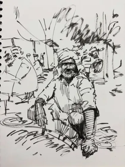 A lively sketch of a man in a market setting, using energetic lines to create a sense of place.