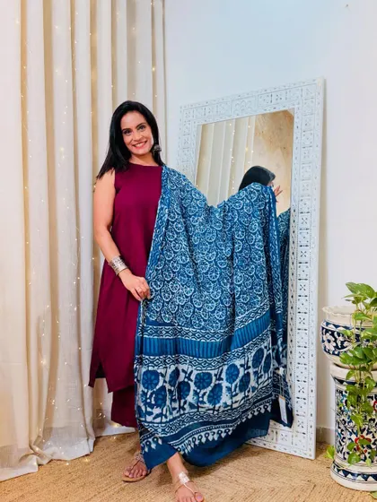 This solid maroon co-ord set looks stunning with the indigo blue hand-block printed dupatta. It's a great way to mix and match basics with statement pieces.
