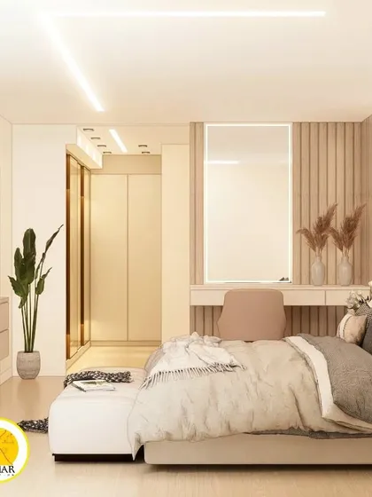 A full view of the bedroom, showing the seamless integration of the bed, TV unit, dressing table, and walk-in closet.