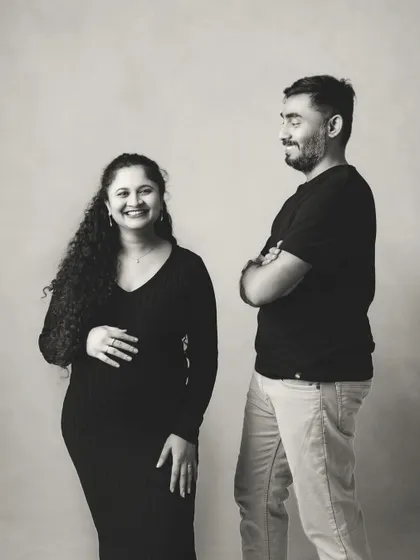 I love the candid feel of this black and white shot. His proud look and her joyful smile perfectly capture the happiness of this chapter in their lives.