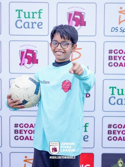 A confident young goalkeeper ready for action. I help players in every position develop their skills and self-assurance.