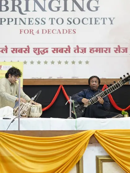 On stage with Ustad Shahid Parvez Khan Sahab in Bhopal. The simple stage setup allows the music to be the sole focus for the audience.
