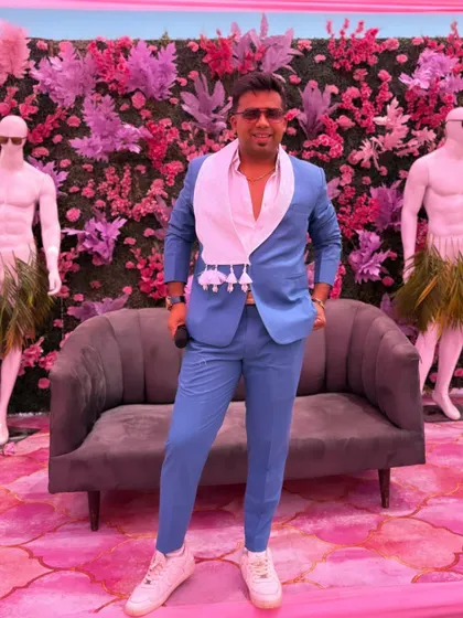 Standing tall between two mannequins. My style is meant to be as bold and eye-catching as the decor at the weddings I host.