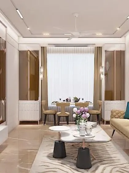 This living room design for a Mumbai apartment uses rose gold accents and reflective surfaces to create a glamorous and chic environment. The layout is optimized for both relaxation and entertaining.
