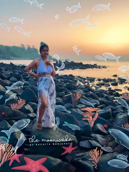 Standing on the rocks at a Goa beach during sunset. I illustrated a whole underwater scene around me, with fish and coral reefs appearing on the shore.