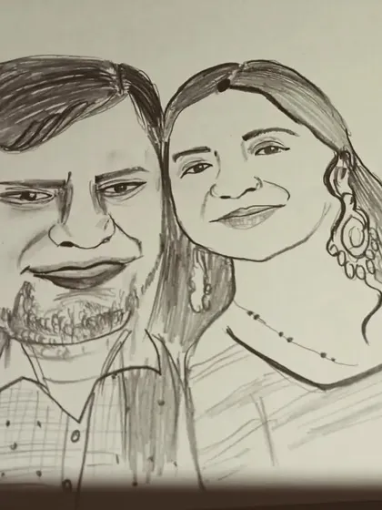 A close-up of a new caricature order for a couple, showcasing the detailed linework.