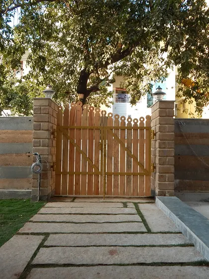 The symmetrical design of this gate and walkway provides a sense of formal order and welcome.