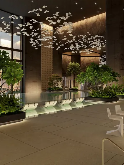 The poolside lounge at Palais Royale, where resort ease meets metropolitan poise. The space is designed for both social gatherings and quiet relaxation, with a material palette of honed stone, warm accents, and lush greenery.
