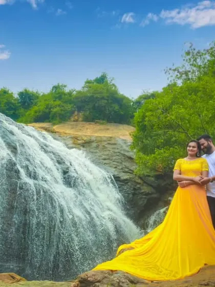 The bright yellow gown stands out beautifully against the waterfall backdrop. My styling packages are perfect for couples planning a nature-based pre-wedding shoot.