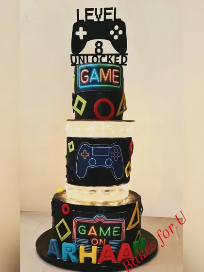 The gaming cake with the lights on, showing off the full "Game On" effect.