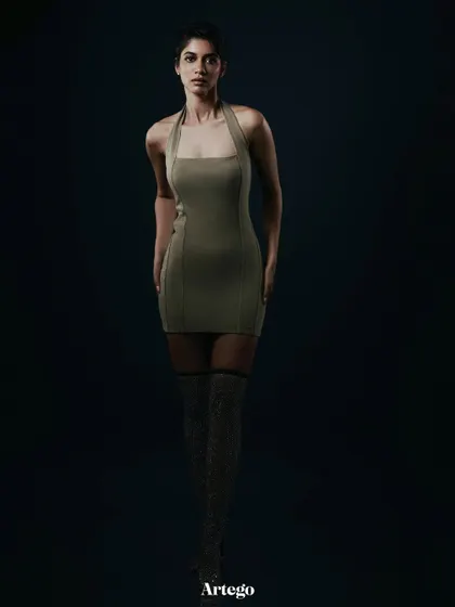A full-length shot for Artego Magazine, emphasizing the model's height and the clean lines of the dress.