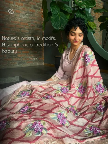 Captivating nature's beauty is woven into every stitch of this long Anarkali suit, which features a stunning hydrangea motif dupatta.