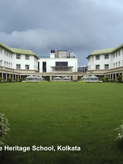 The Heritage School in Kolkata features a large central quadrangle, a classic element of institutional design. This expansive green lawn provides a space for formal events and informal recreation, promoting a sense of community and well-being.