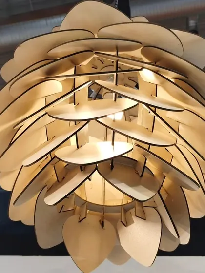 Design is key. This artistic wooden light fixture is an example of the beautiful products we can control with our automation systems.