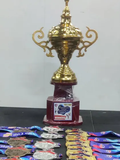 The winners' trophy and medals from the 5th National Level Taekwondo Championship organized by TEAM VIFA, where we won 12 Gold, 5 Silver, and 5 Bronze.