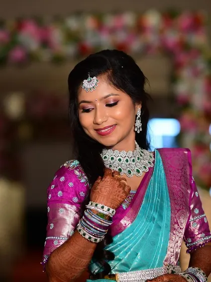 Apoorva looking lovely for her reception. Her makeup is soft and pretty, with a focus on flawless skin and a gentle smile.