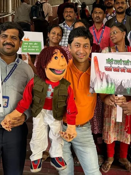 Interacting with commuters and election officials at a Mumbai railway station to spread awareness about the importance of voting.
