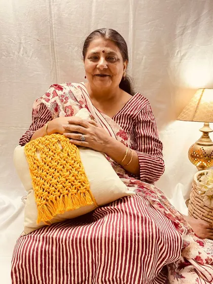 Here I am with one of my macrame cushion tie-backs. It’s a simple way to add a bit of texture and personality to a plain cushion. I love how this mustard yellow piece brings a pop of color and a cozy, handcrafted feel to the room.