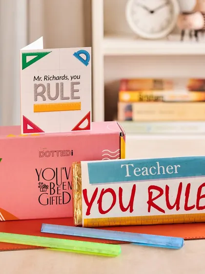 This "You Rule!" themed gift box for a teacher includes a custom chocolate bar and a fun greeting card, making for a sweet and simple token of appreciation.