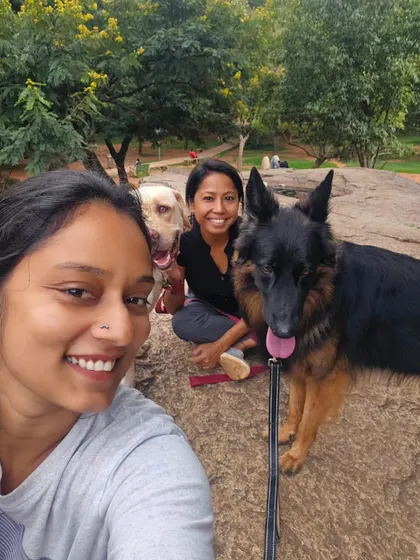 A happy selfie after a successful socialization session at the park. Both dogs are calm and relaxed, showing that they can enjoy an outing together without any issues.