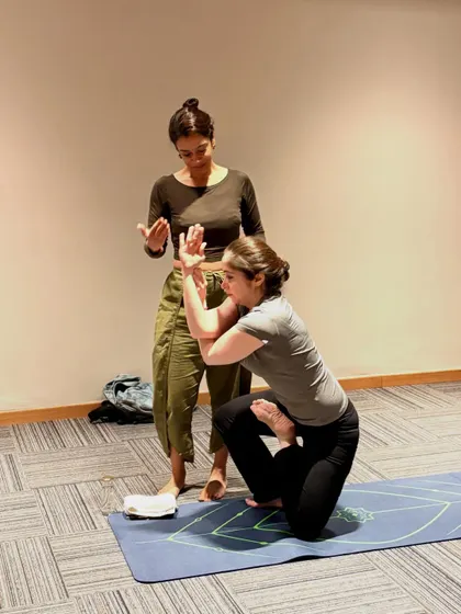 A closer look at the hand and arm alignment in Vatayanasana. These small, precise adjustments help protect the joints and deepen the student's understanding of the posture's mechanics.