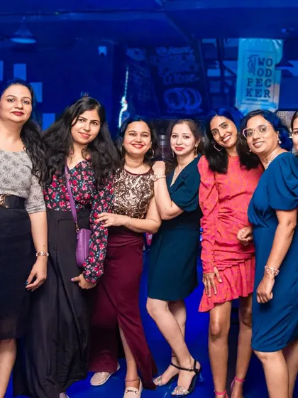 A group of friends looking stylish and ready to party. My pub's ambiance is perfect for a glamorous night out.