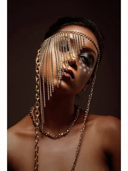 This is a conceptual piece where I explored the idea of being both seen and unseen. The cascading chains create a veil, transforming a simple portrait into a high-fashion statement, perfect for an editorial or avant-garde portfolio.