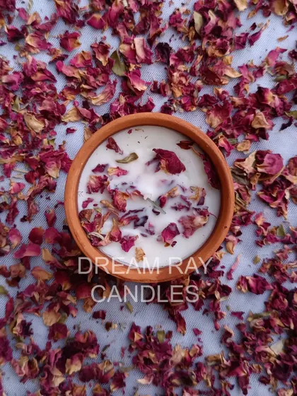 My rose-scented candle, hand-poured in a rustic terracotta jar and topped with dried rose petals. This is one of my most popular botanical options for a classic floral fragrance.