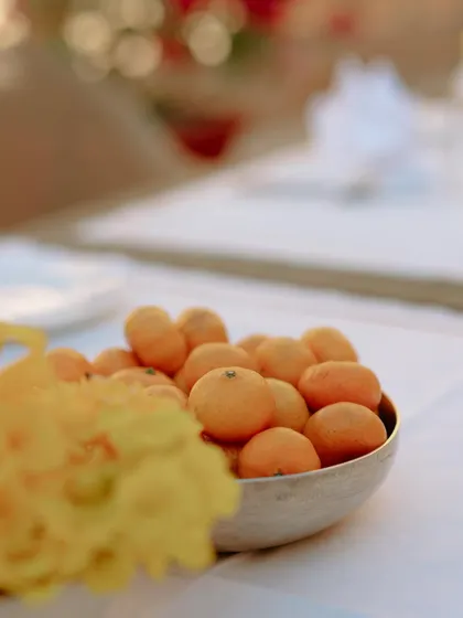 Sometimes, simplicity is everything. A bowl of baby oranges adds a pop of color and a touch of summer freshness to the decor for a wedding day brunch.