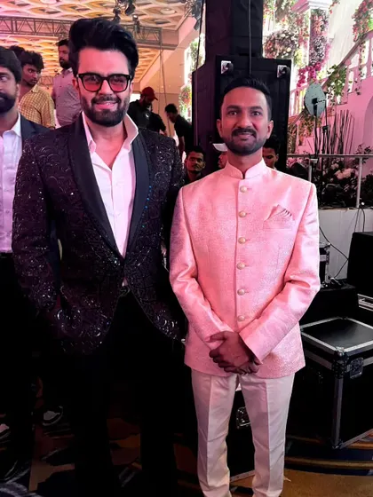 A truly memorable moment sharing the stage with Manish Paul, one of India's top hosts, at the Jio World Convention Center in Mumbai. I was honored to perform a live sand art and glitter painting show for this grand engagement ceremony.