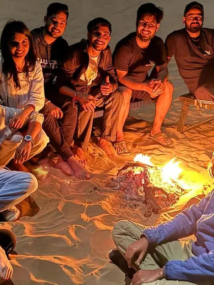 A full group enjoying a bonfire on the sand dunes. We create a safe and social atmosphere for everyone to relax and have a good time.