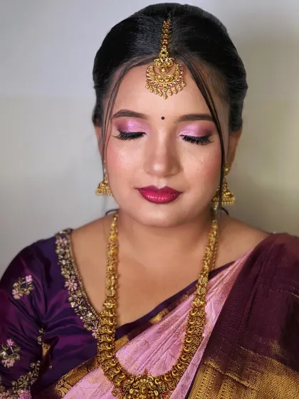 Another angle of the soft, pretty-in-pink makeup look, perfect for a bridesmaid attending a South Indian wedding.