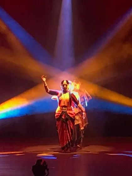 A dramatic moment from 'Akhandalaya: The Unvanquished Rhythm'. Through powerful lighting and classical form, this production explores timeless spiritual themes, showcasing the pure, unadulterated energy of Bharatanatyam.