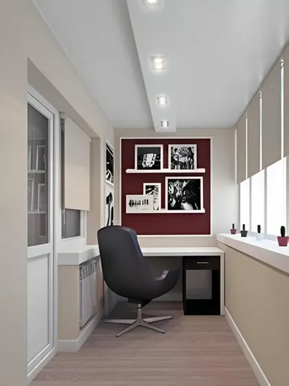 This enclosed balcony office uses a bold accent color and gallery wall to add personality. The minimalist desk and ergonomic chair create a comfortable and stylish workspace.