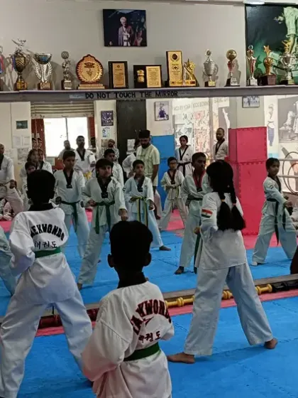 A view from the back of the dojang, showing a full class in action.