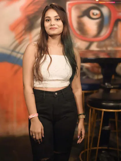 A guest posing against the venue's cool graffiti art wall.