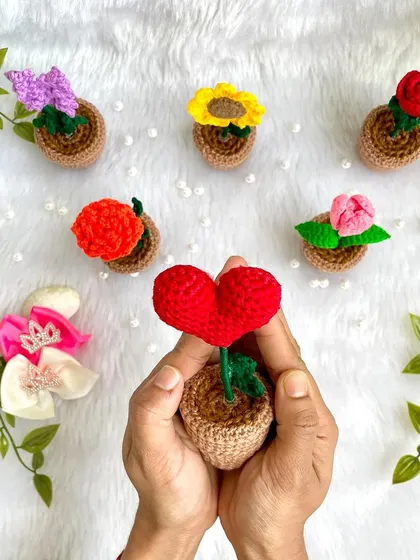 My hands cradling the little potted heart. It’s a simple and sweet way to send a message of love.